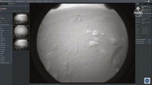 This NASA photo shows NASA's first image from the Perseverance rover as it landed on the surface of Mars on February 18, 2021